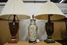 Two Toleware style urn shaped table lamps and a Chinese style lamp.