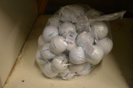 A bag of Titleist golf balls.