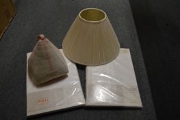 A door stop, pleated lamp shade and duvet covers.
