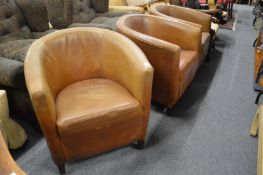 Three tub armchairs.