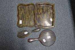 Faux tortoiseshell dressing table items.
