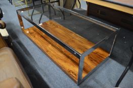 Merrow Associates, a chrome glass and rosewood two tier rectangular coffee table.