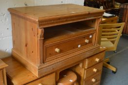 A pine single drawer TV stand.