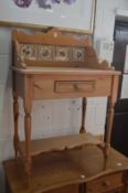 A pine wash stand with tiled back.