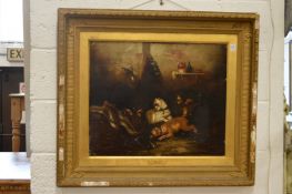 George Armfield, playful dogs in a barn interior, oil on canvas in a decorative gilt frame.