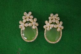 Pair of decorative ear clips.