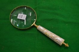 A decorative magnifying glass.