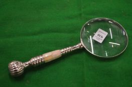 A decorative magnifying glass.