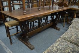 An oak refectory style dining table.