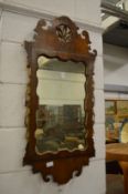 A walnut fretwork framed mirror with gilded decoration (losses).