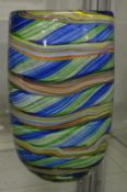 A large colourful art glass vase.