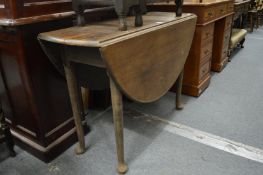 A mahogany dropleaf gateleg dining table.