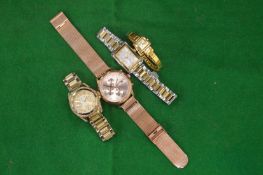 A Tommy Hilfiger wrist watch and three others.