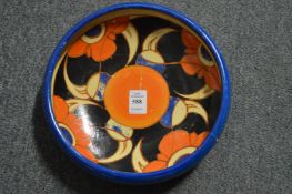A Clarice Cliff Bizarre circular bowl (broken and restored).
