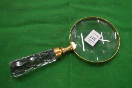 A decorative magnifying glass.