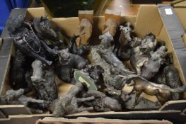 A collection of horse and dog ornaments.