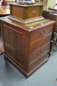 A mahogany pedestal filing cabinet.