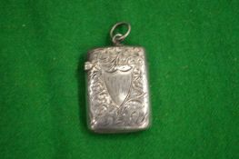 An engraved silver vesta case.