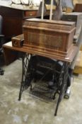 A Singer treadle sewing machine.