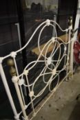 A Victorian style cream painted wrought iron double bed frame.