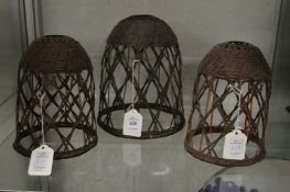 Three unusual wicker lampshades.
