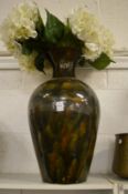 A large glazed pottery vase.