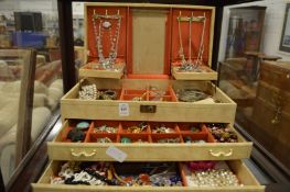 A good large jewellery box containing a quantity of costume jewellery.