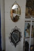 Two decorative mirrors.
