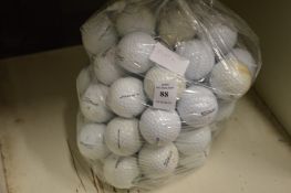 A bag of Titleist golf balls.