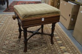 A Victorian walnut adjustable music seat.