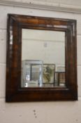 A good period walnut cushion framed mirror.