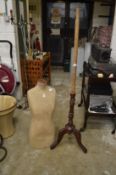 A dressmakers dummy with tripod stand.