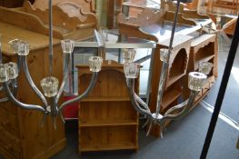 A pair of stylish chrome plated five branch chandeliers.