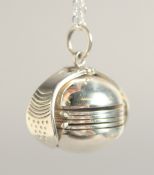 A SILVER FOLDING BALL LOCKET AND CHAIN.