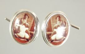 A PAIR OF SILVER EROTIC CUFFLINKS.