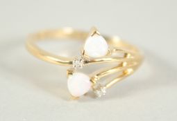 A 9CT. GOLD OPAL AND DIAMOND CROSSOVER RING.