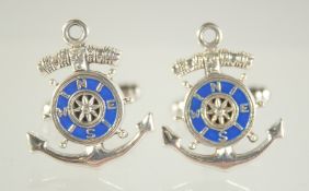 A PAIR OF SILVER SHIPS WHEEL CUFFLINKS.
