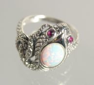 A SILVER OPAL AND RUBY SNAKE RING.