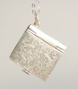 A SILVER BOX LOCKET ON A CHAIN.