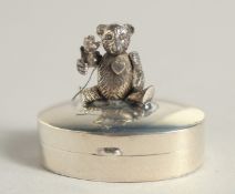 A SILVER ARTICULATED TEDDY BEAR PILL BOX, 1.25