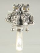 A SILVER AND MOTHER OF PEARL DOUBLE TEDDY RATTLE.