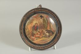 A PORCELAIN POT LID, THE GAME BAG 4ins diameter. Framed
