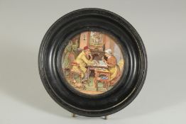 A PAIR OF PORCELAIN POT LIDS, 4ins diameter, framed.