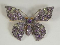 A 9CT. GOLD AND SILVER AMETHYST, PERIDOT AND DIAMOND BUTTERFLY BROOCH.