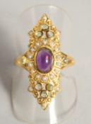 A SILVER AND 18 CT GOLD PLATED PERIDOT AND PEARL SUFFRAGE GEM RING.