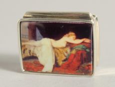 A SILVER AND ENAMEL NUDE PILL BOX, 1.25