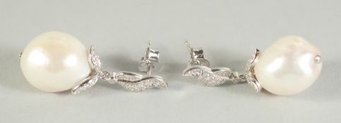 A PAIR OF SILVER BAROQUE PEARL DROP EARRINGS.