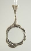 A SILVER MERMAID MAGNIFYING GLASS ON A CHAIN.