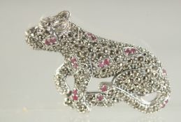 A SILVER RUBY SET PANTHER BROOCH.