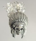 A NATIVE AMERICAN SKULL PENDANT AND CHAIN.